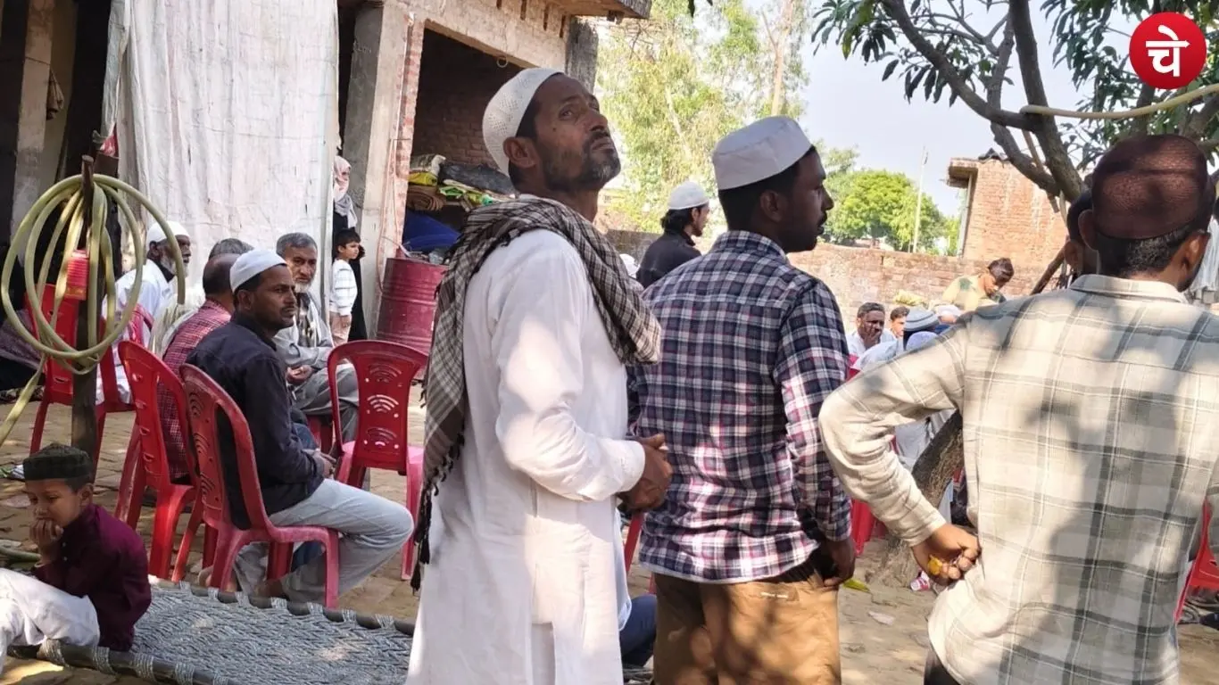 A crowd of grieving family members and villagers following an accident in Bijnor